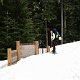 Me at the half buried trailhead sign. <Photo by Kim>