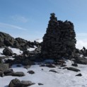 Mt Washington peeks through from behind the big cairn below the summit of Jefferson.