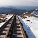 Sick of postholing, we opt to walk on the rail track.